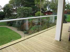 structural glass balcony with white handrail