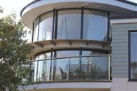 Curved Glass Sliding Door and Curved Glass Balustrade adds light to South Devon Coast home