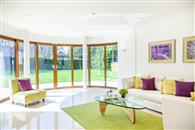 Curved Glass Sliding Doors and matching RAL colour Glass Juliet add WOW factor to stunning, modern Sussex home