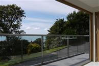 A Review on Glass Balustrade in Sandgate. The balusrade combines the best balance of maximum visibility through glass and a pleasing, strong supporting structure. The anodised royal chrome design is very pleasing to the eye.