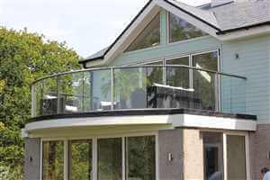 Royal Chrome curved balustrade on a pretty house with lovely gardens