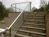 Glass stair railing - a run of glass with a handrail on top, alongside a flight of indoor or outdoor stairs. It is a glass balustrade for stairs and we have been specializing in stair glazed balustrading systems.