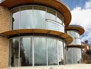 Curved glass doors with self-cleaning glass coating 