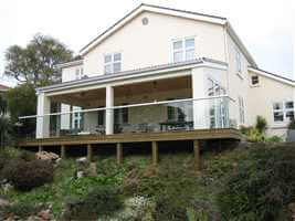 semi frameless white balcony on white house