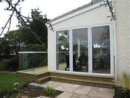 Glass Balcony semi-frameless with white handrail