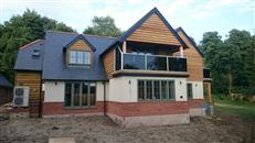 Constructed in just six months on a rural Hampshire plot, this impressive self-built five-bedroomed home boasts two sizeable balconies supplied by Balconette that take advantage of extensive garden and countryside views.