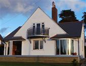 Curved Glass Doors Review from Barry, Wales. The Curved Patio Door solution although not cheap was a value for money solution to maintain the aesthetic building design envisaged by the original Architect and with the addition of the raised decking completes the buildings aspect and allows the client to sit either inside the patio doors in adverse weather conditions or on the decking to enjoy the wonderful sea views and lake land park.