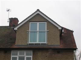 Silver Juliet balcony on pebble dash house