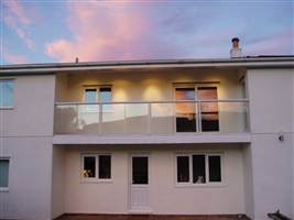 White balustrade on a white recidence in the sunset