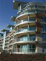 Curved Balconies on the corner of Trent Park with silver handrails