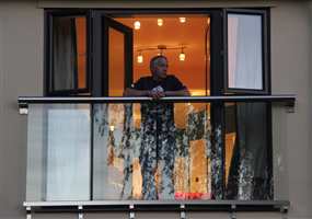 Man leaning on large Royal Chrome Juliet balcony