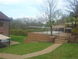 Royal Chrome balcony in a garden with a path