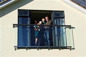 Family standing by their Royal Chrome Juliet balcony