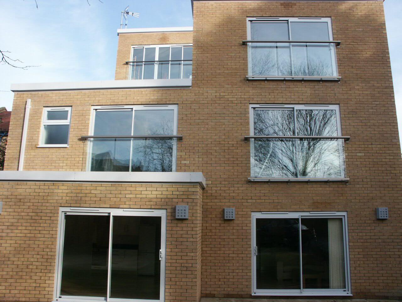 Many Bronze Juliet balconies on one building