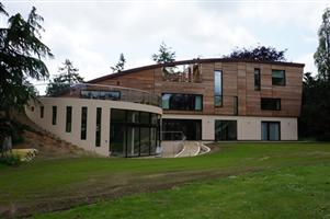 curved patio doors and glass balcony