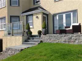 Small Glass Balcony in Scotland by a lake