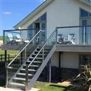 Elevating Spaces: The Luminescent Brilliance of Glass Stairs Balustrades in Open Concept Living - Balconette