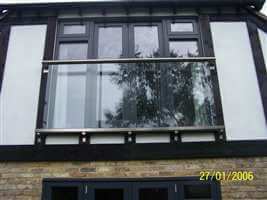 Tudor style house with large Royal Chrome Juliet balcony