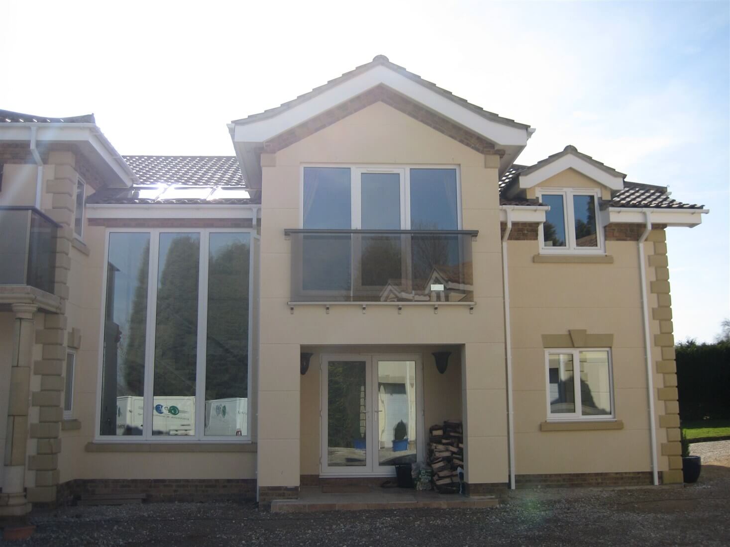 Bronze handrail, tinted glass Juliet Balcony