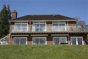 Long Royal Chrome balustrade covering two sides of the house