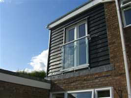 Small silver Juliet balcony in the sun