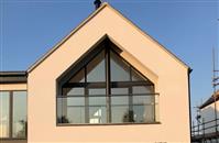 Two Balconette glass balconies were chosen to maintain the sunny west-facing views over open fields in a new-build house in Stafforshire.