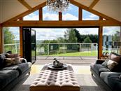 An airline pilot made excellent use of his time on furlough by completely refurbishing his spacious outdoor deck and self-installing this spectacular multi-level Balconette glass balustrade at his home near Worcester in rural Worcestershire.