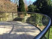 Enhancing buildings and homes through the use of curved glass and curved elements.