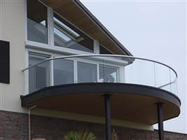 Semi frameless balcony with silver handrails