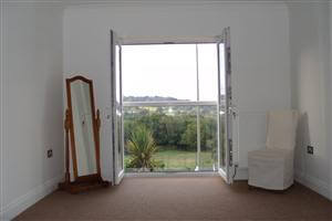 looking out through a clear glass, white Juliet balcony