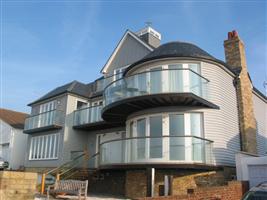 curved balconies with glass near caterbury