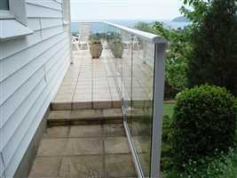 Side on view of a white aerofoil balustrade on a white house