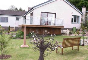 glass balcony on a timber deck dalbeattie