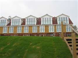 White Juliet balconies on the coast