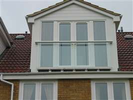 Long white Juliet balcony on the coast