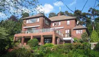 Large house with large balcony with Royal Chrome handrails and posts