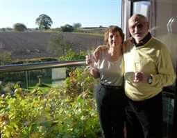 Couple standing by their Royal Chrome Juliet balcony