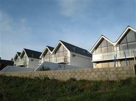 Matching Royal Chrome balconies on coast houses