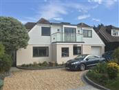 An external Aerofoil glass balustrade balcony supplied by Balconette was installed in a 1950s bungalow renovation in Hampshire. 