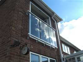 Large Juliet balcony in the sun with silver handrail