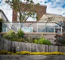 Glass Balustrade over pretty Sussex garden