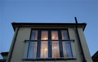 Royal Chrome Juliet balcony in the evening