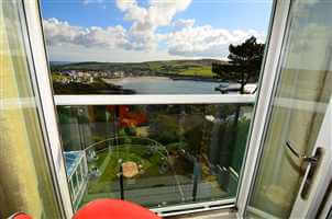 Isle of Man views through a white Juliet balcony