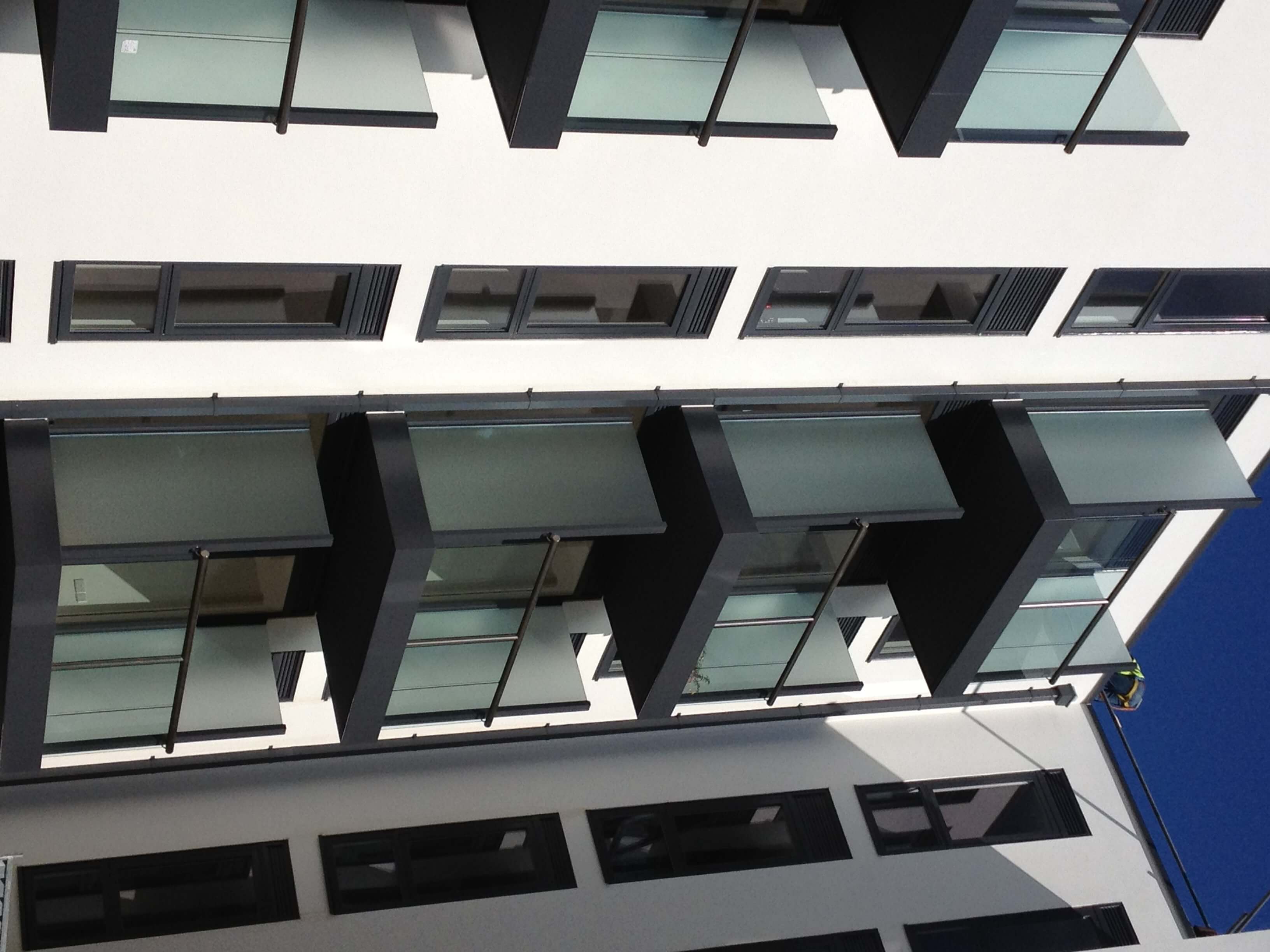 Glass privacy screens fitted to balconies