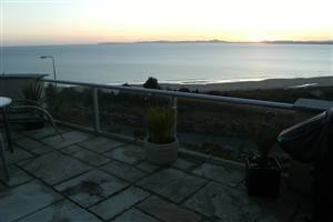 Royal Chrome balustrade between stone walls at sunset