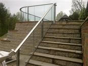Glass stair railing - a run of glass with a handrail on top, alongside a flight of indoor or outdoor stairs. It is a glass balustrade for stairs and we have been specializing in stair glazed balustrading systems.