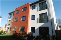 The contemporary, clean lines of Frameless glass Juliet balconies supplied by Balconette perfectly complement the striking exteriors of a new individually designed development in Exeter.