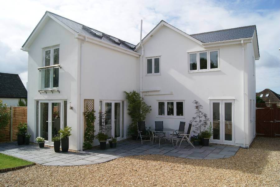Small Juliet balcony with a Royal Chrome handrail on a beautiful white house