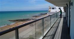 Spacious glass balconies of a new luxury apartment development on the South Coast. Glass Balustrading by Balcony Systems in Rottingdean.