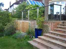 Stairs leading from Royal Chrome balcony to the garden